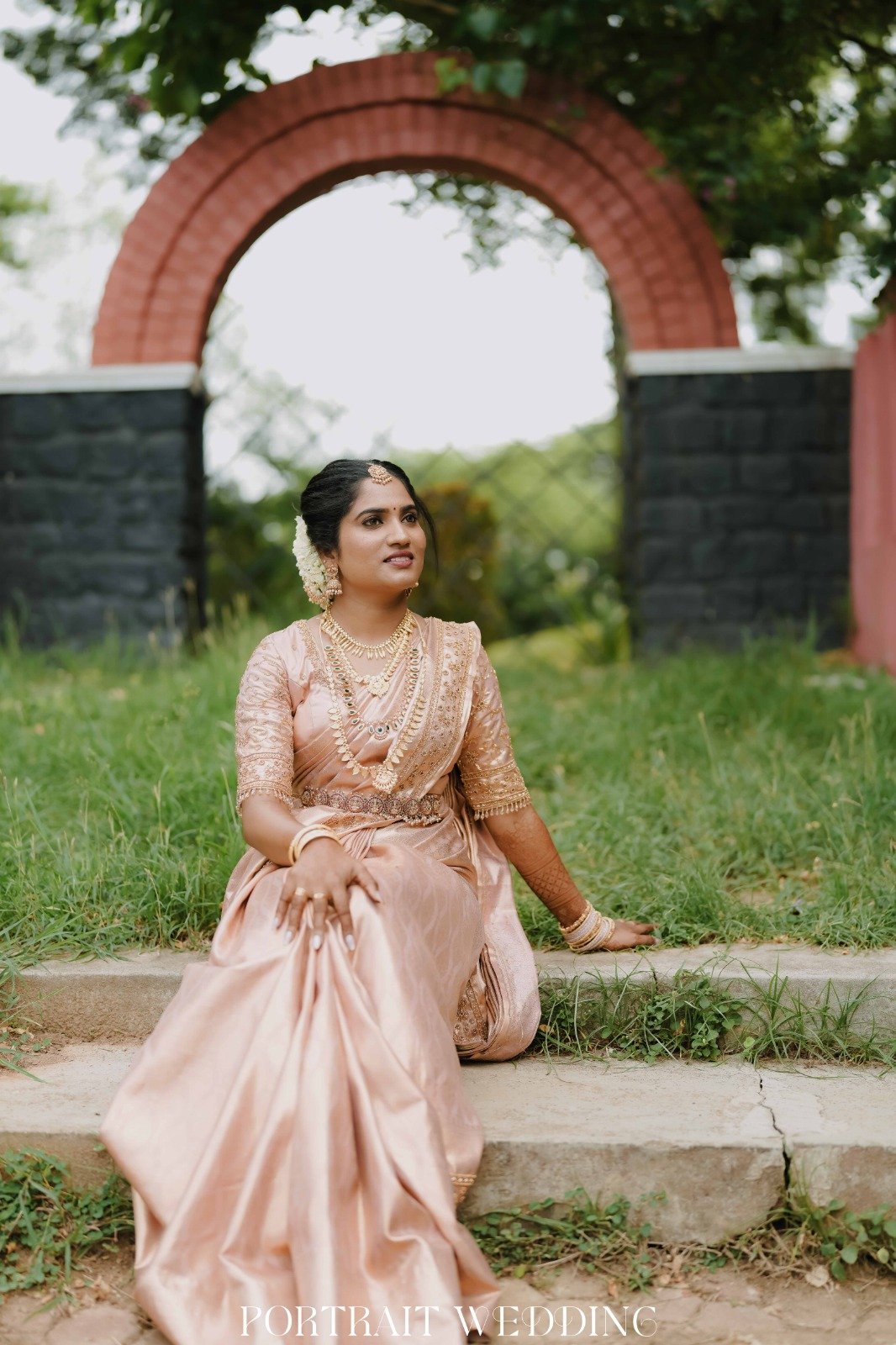 Bride Seated in Garden Steps